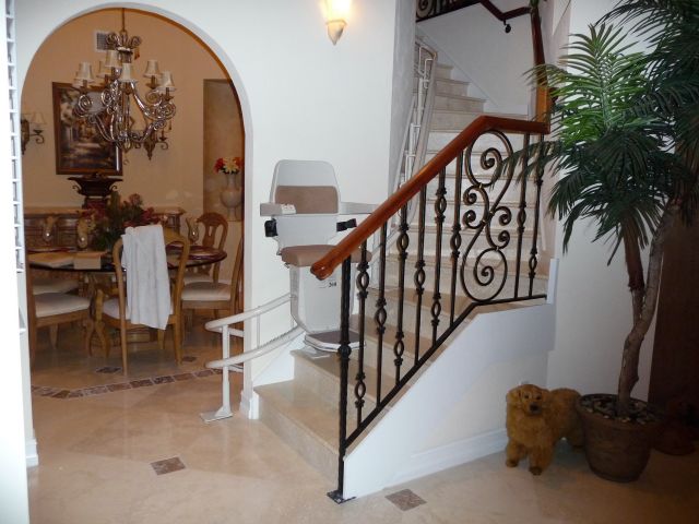 Curving stairlift on a marble staircase