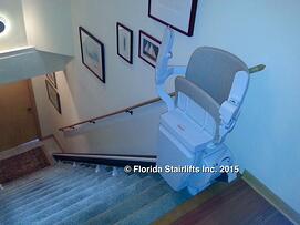 Stannah 600 stairlift folded close to the wall